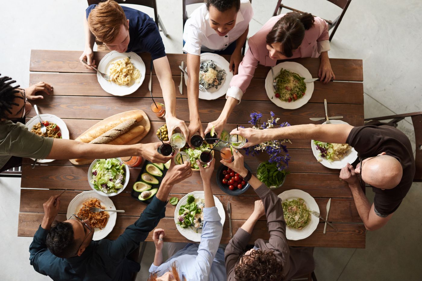 Friends toasting around the dinner table